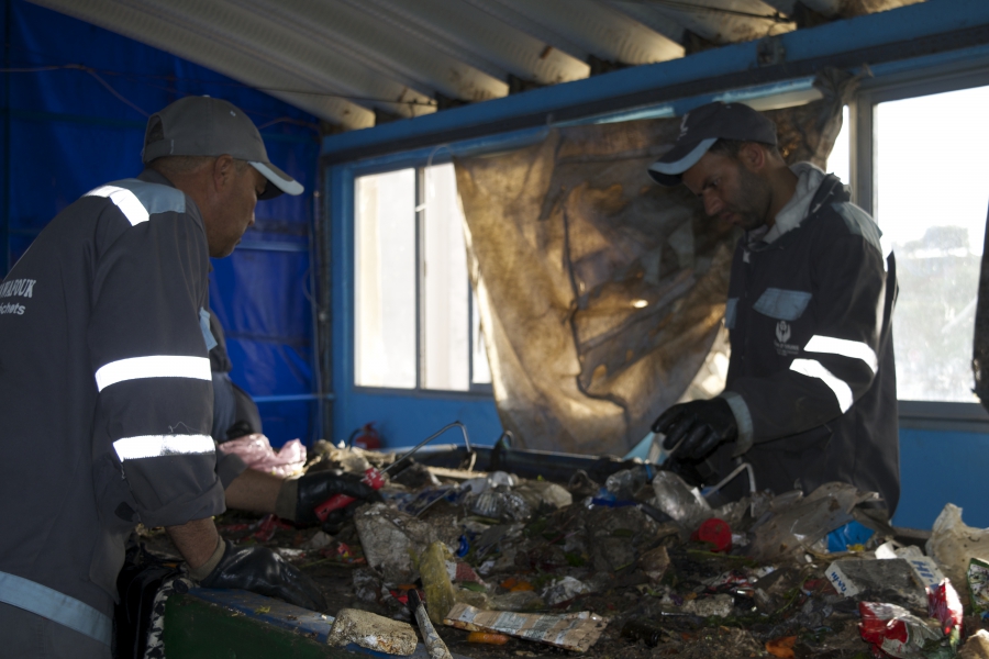The former trash pickers went from competitors for junk at the dump to co-workers at the new recycling facility. Together they recycled more than 12,000 tons of trash in 2016. Backers hope the new facility will be a model for others around the world.